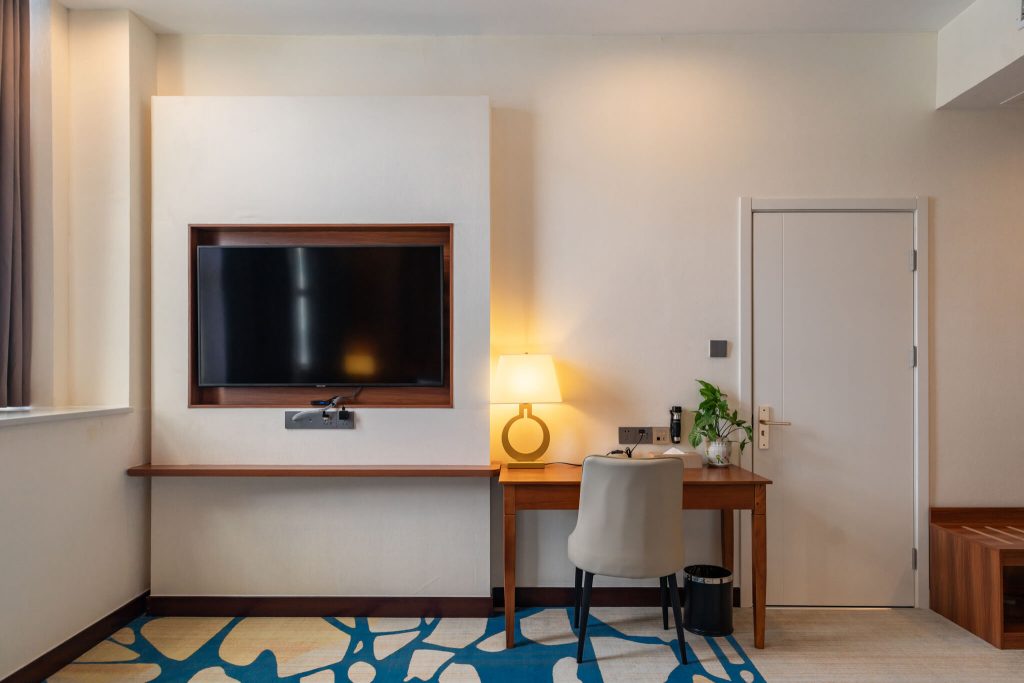 Facilities Royal Legend hotel room of television and study desk in Legend Hotel & Resort Sihanoukville, Cambodia.