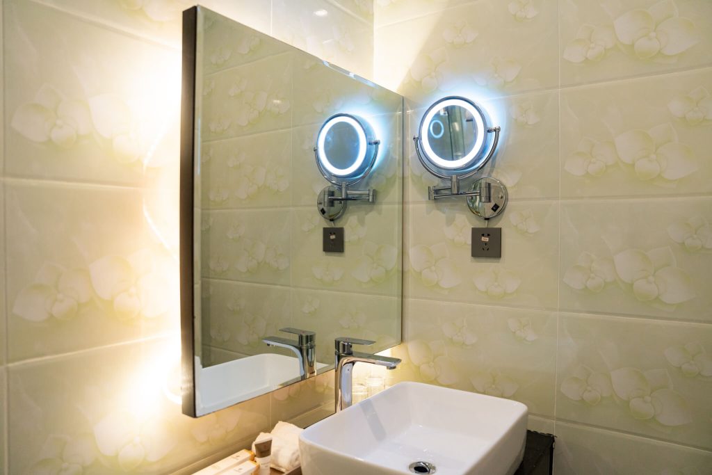 Legend Hotel & Resort Sihanoukville: adjustable LED makeup mirror and modern decor at Royal Legend room.