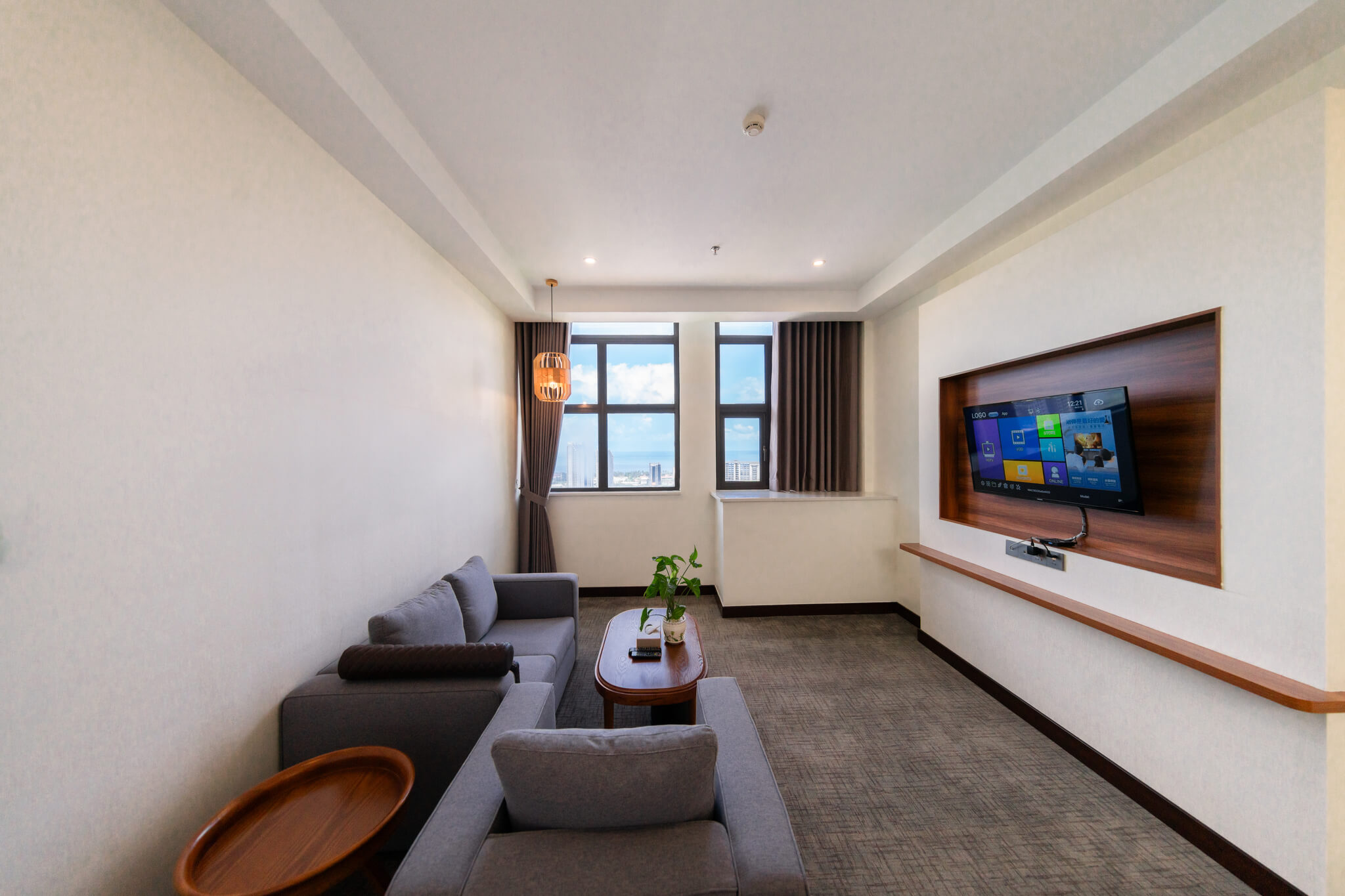 Legend Hotel and Resort Sihanoukville: A comfortable Executive Suite with a king bed, smart TV, and city view, designed for a high-quality guest experience.