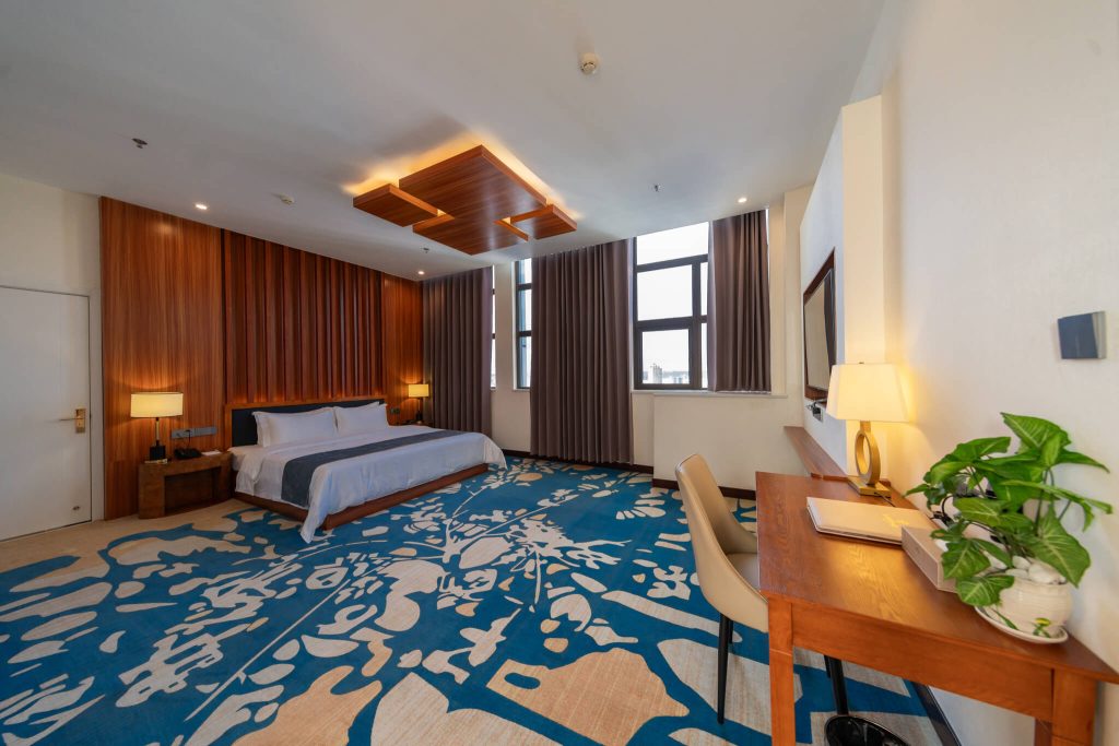 Cozy Royal Legend hotel room with king bed ocean view and city view of Legend Hotel & Resort Sihanoukville, Cambodia.