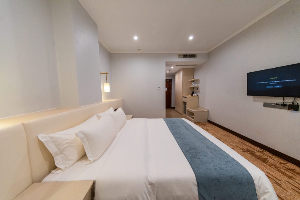 Photo of a Superior King room at Legend Hotel & Resort Sihanoukville, Cambodia. The room features a large bed and a large LCD TV.