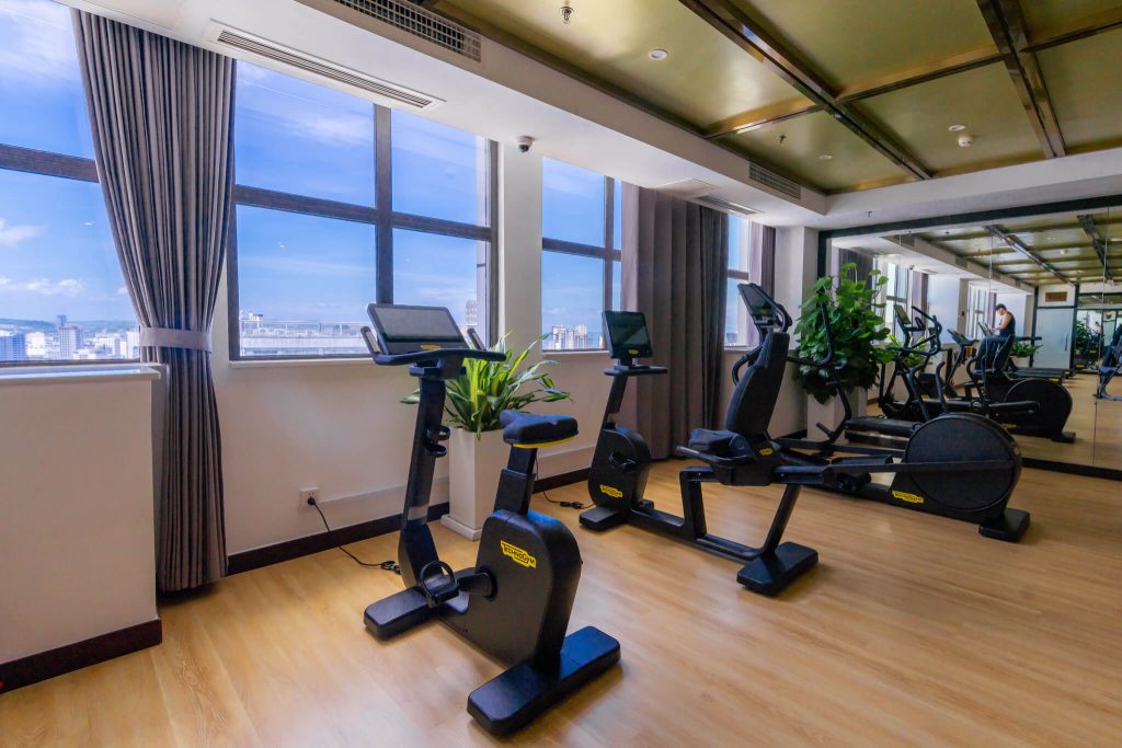 The gym at Legend Hotel & Resort Sihanoukville, Cambodia, offers stunning views of the city and the sea while you work out.
