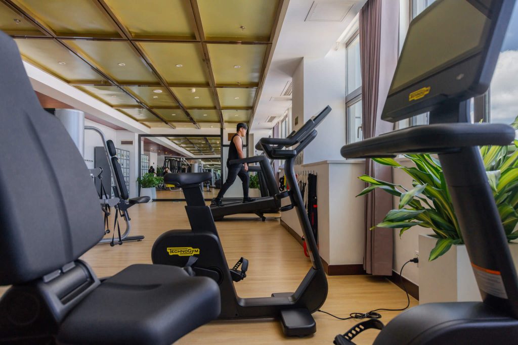 Overlooking view of The Legend Hotel & Resort Sihanoukville's modern gym area featuring treadmills.